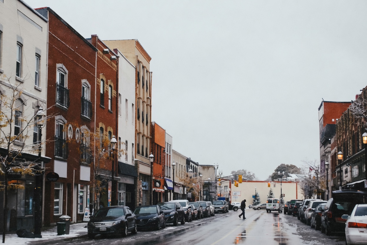 Snowy downtown main street in Barrie, Ontario with brick storefronts