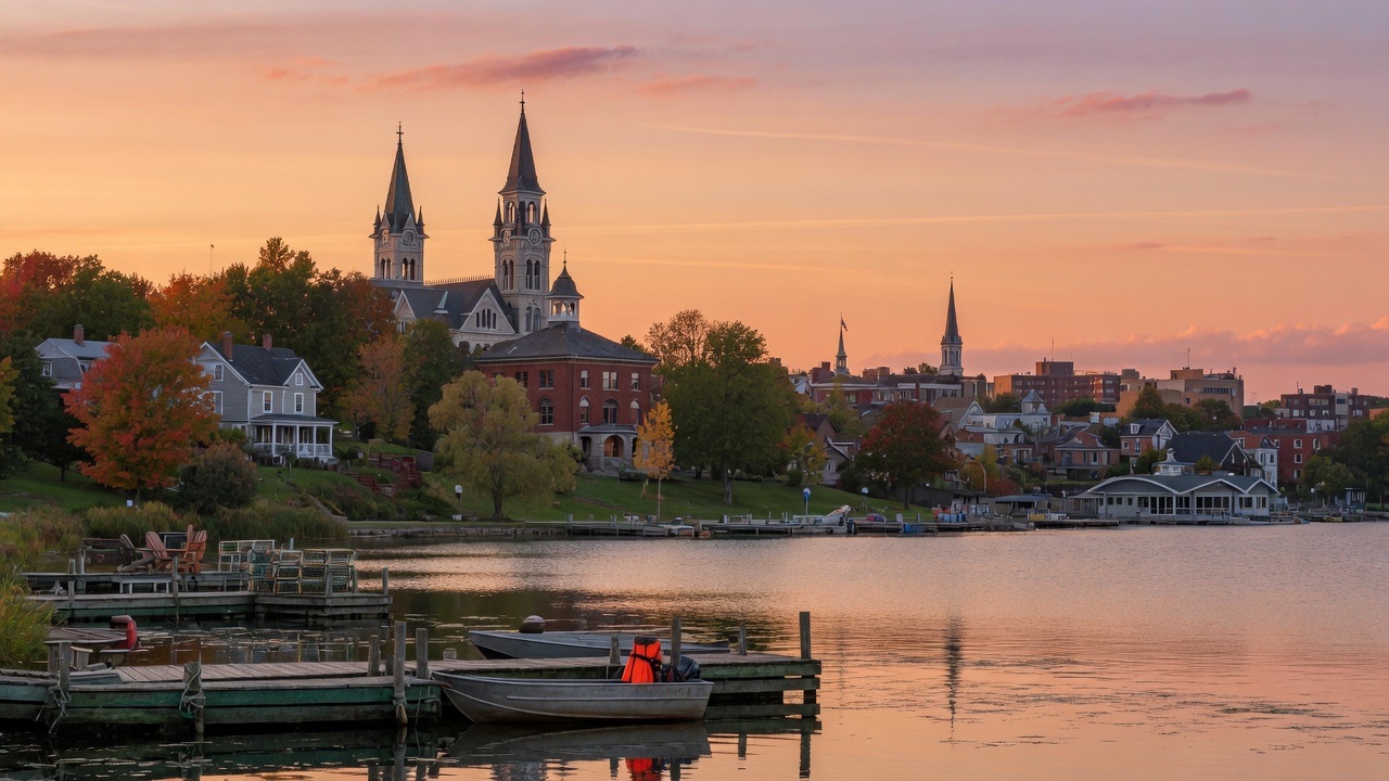 Orillia waterfront on Lake Couchiching at golden hour with town skyline